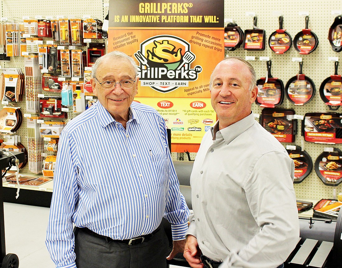 Far East Brokers founder Charles Zimmerman, left, with his son, Morrie Zimmerman, the companyâ€™s president and CEO.