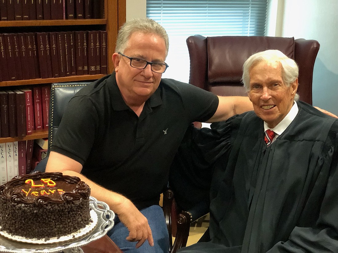 The late U.S. Bankruptcy Judge Paul Glenn, right, and Barry Clark, his courtroom administrator.