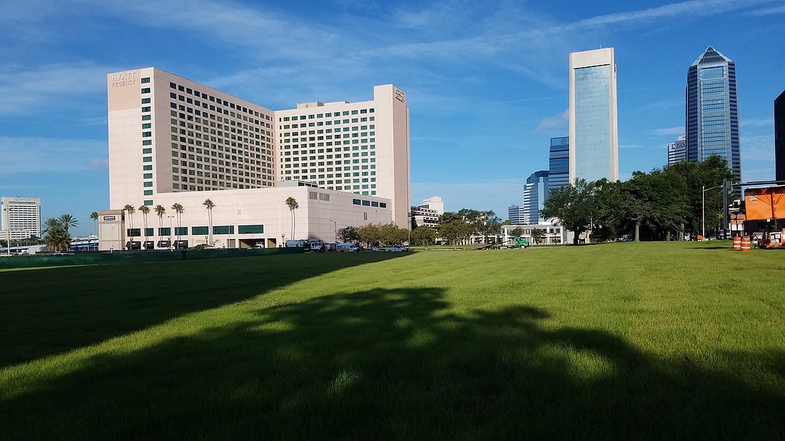 The view from Liberty Street looking west toward the Hyatt Regency Jacksonville Riverfront hotel and Downtown. The former location of the old Duval County Courthouse is now a lawn available to reserve from the city for events.