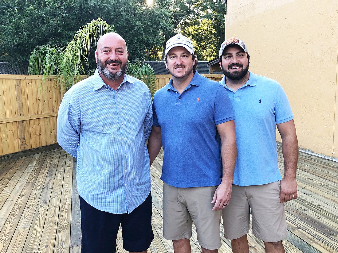 From left, Louis M. Joseph and cousins Matt Joseph and Louis J. Joseph at the former Mudville Grille in Arlington that they are converting into Southern Coast Seafood.