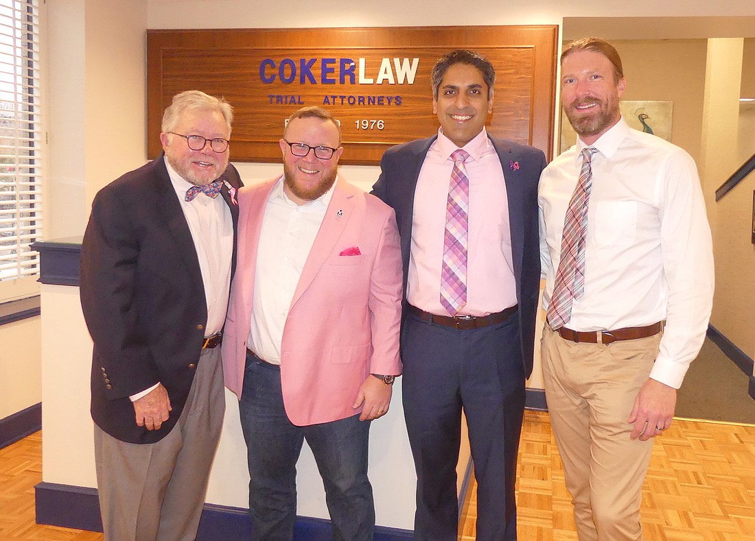 Photo by Max Marbut From left, Howard Coker, Dan Iracki, Fraz Ahmed and Joel Harris, the Coker Law â€œReal Men Wear Pinkâ€ team.