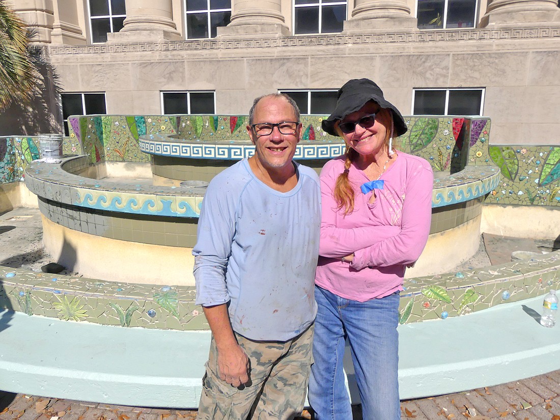 Artists Carlos Alves and J.C. Carroll are transforming the fountain in front of the Yates Building Downtown along Forsyth Stree