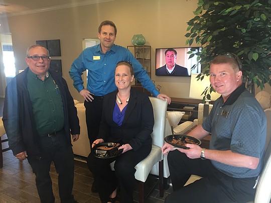 Daryl Gilbert and Jim Slavin, both of D.R. Horton, Christina Bentley of La Rosa Realty and Scott Hum of Re/Max Specialists at the opening of D.R. Horton's model in Deerfield Preserve.