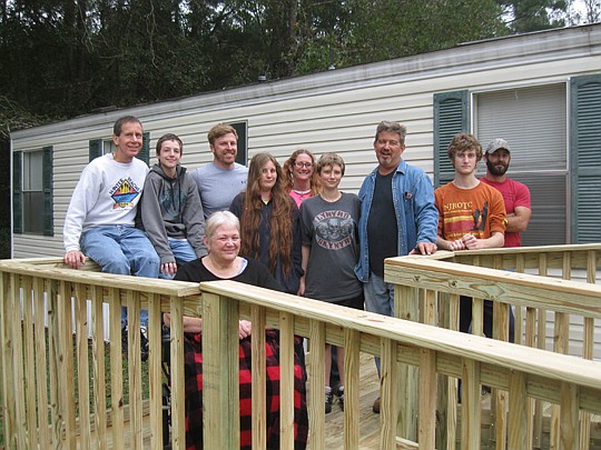Members of a Thursday morning Bible study group live their faith by helping others. This group helped build a wheelchair ramp for Stephanie Keaton, giving her access to the outdoors.