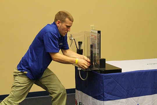 Don't get in his way. Kyle Slagle of Avesta Homes was serious about repairing a leaky faucet valve at First Coast Apartment Association's Maintenance Mania. Slagle went on to win the contest, clocking the best combined times among over 100 workers.