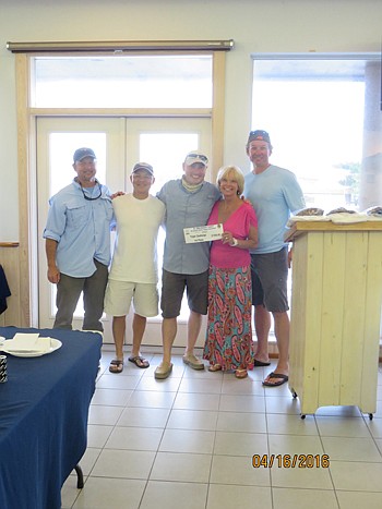 Triple Challenge winners Prime Lending's Benny Guzman, Voradet Thepsovanh and Michael Gayda are congratulated by Holly Yelton and Dennis Ginder.