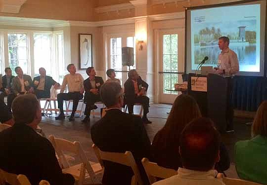Jason Sessions, general manager of RiverTown, speaks to the crowd of builders, real estate agents and developers at the Urban Land Institute North Florida's "Moving Dirt" event. Developers updated attendees on the major projects for St. Johns County.