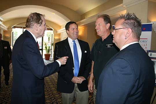 Watson Realty Corp. owner William Watson Jr., left, chats with Florida Sen. Aaron Bean, R-Fernandina Beach, and The Legends of Real Estate East Coast's Paul Gruenther and Andrew Bell before the Northeast Florida Association of Realtors meeting in May.