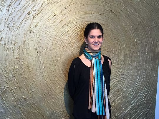 Jacksonville artist Blair Hakimian stands in front of one of her art pieces at her Mandarin gallery and studio. "Oro" is aged gesso, acrylic and 24-carat gold leaf. She created it as the focal piece at her studio entrance, but it has found a corporate...
