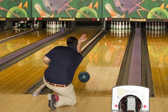 The Northeast Florida Builders Association's Remodelers Council raised money for Builders Care through a Cosmic Bowling tournament at Beach Bowl in Jacksonville Beach.