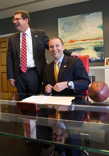 City Council President Greg Anderson and Mayor Lenny Curry were all smiles Wednesday shortly after signing a five-year contract extension for the annual Florida-Georgia football game.