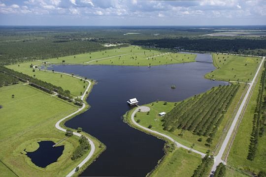 An aerial of the northwest quadrant of Hutson Ranch, which includes two airstrips and a two-story house over a 50-acre stocked lake. The listing price is $28.9 million.