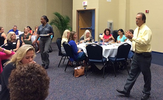 Greg Kershner from ServiceMaster Restoration of First Coast talks with the Women's Council of Realtors about mold remediation during the June meeting and luncheon at the University of North Florida.