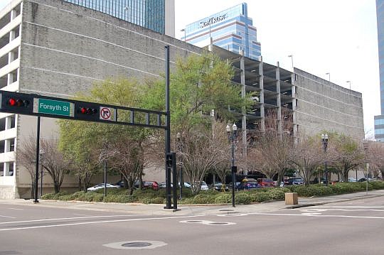 A parking garage is being proposed for this corner of Forsyth and Main streets, which is between three existing garages.