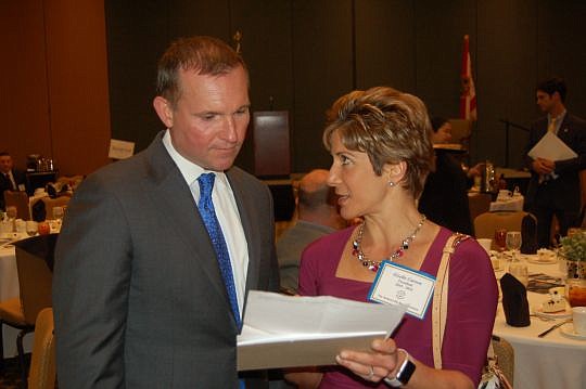 Mayor Lenny Curry and Giselle Carson, president of The Jacksonville Bar Association, talk before the Bar's monthly meeting Friday at the Hyatt Regency Jacksonville Riverfront.