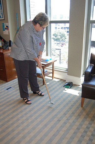 Jacksonville Public Library Deputy Director Jennifer Giltrop is an avid golfer, so why not have a putting green of sorts in her office?