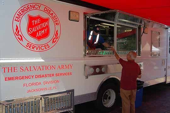 As part of its celebration of 125 years of service in Jacksonville, The Salvation Army of Northeast Florida gave away doughnuts and bottled water Tuesday afternoon in Hemming Park.