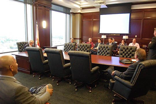 Fourth Circuit Chief Judge Mark Mahon, seated far left at the table, invited judicial candidates to the Duval County Courthouse on Thursday for a seminar about conduct during an election.