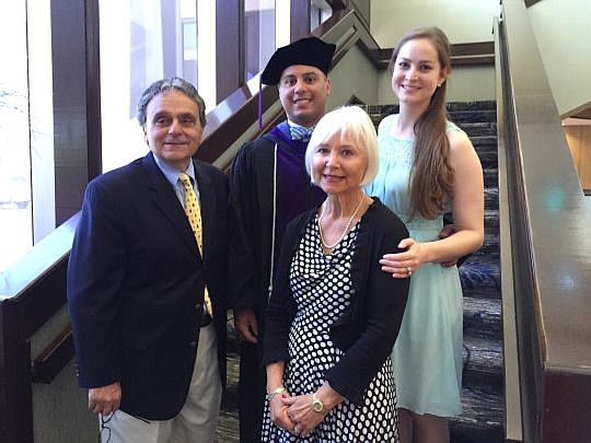 Florida Coastal School of Law graduate Aaron Conti with his family Saturday during the school's graduation ceremony. His father and mother, Nick and Vergie, and wife, Caitlin, were among those who were there in support. See more photos from the gradua...