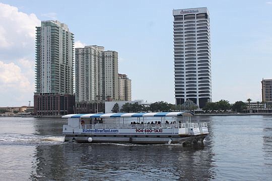 The St. Johns River Taxi makes its way toward the Jacksonville Landing on Thursday, one of many trips on a hot day along the river. Lakeshore Marine Services has operated the  business for more than a year.