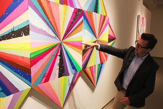 Ben Thompson, Museum of Contemporary Art Jacksonville deputy director, explains how a colorful piece by Maya Hayuk was constructed. Thompson was named deputy director in May after almost 10 years with the museum.