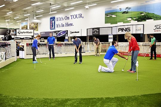A putting green inside the PGA Tour Superstore. One is shown on a site plan for The Strand at Town Center.