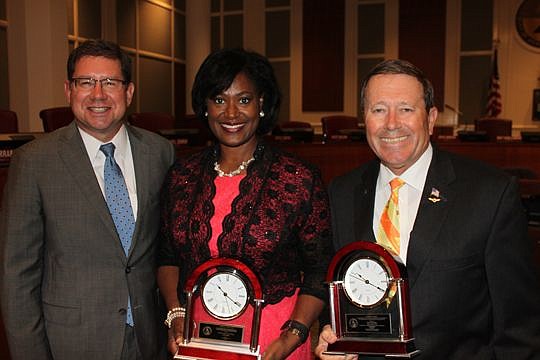City Council President Greg Anderson, left, handed out several year-end awards Tuesday evening to his colleagues, including the Charles E. Webb Award to Joyce Morgan and the President's Award to Jim Love. Morgan received the award for her community ou...