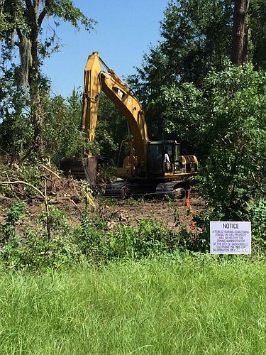 Trees are coming down on the perimeter of the site where Amazon.com is expected to build a fulfillment center.