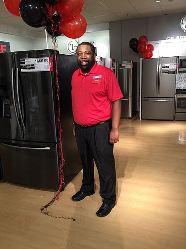 JCPenney General Manager Michael Burkett showed off the store's new major appliance showroom Friday. The company began selling appliances again after more than 30 years.