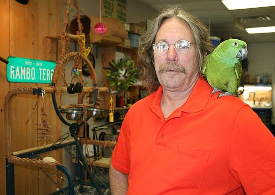 Delcher Carter and his parrot, Rambo