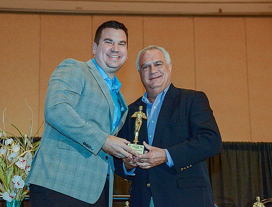 Cole Slate, left, was named associate sales person of the year, and Ron Harris, of Harris Partners, received an appreciation award at the 2016 Excel Awards at the Southeast Building Conference. Slate is with Exit Real Estate Gallery.