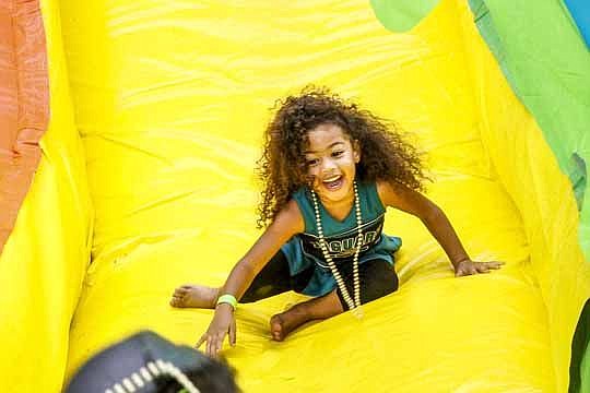 While it was football on the field Friday night, children like 3-year-old Norvie Whetsul enjoyed an array of slides, games and even getting slimed at EverBank Field. The Jacksonville Jaguars and Nickelodeon teamed up for the Road to Worldwide Day of P...