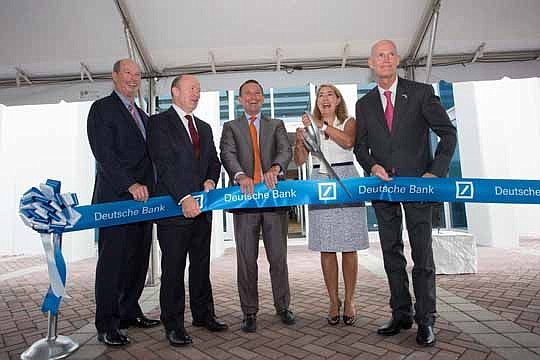 From left, JAXUSA Partnership President Jerry Mallot, Deutsche Bank CEO John Cryan, Mayor Lenny Curry, Deutsche Bank Regional Head Leslie Slover and Gov. Rick Scott cut the ribbon to open the bank's expansion at 5201 Gate Parkway.