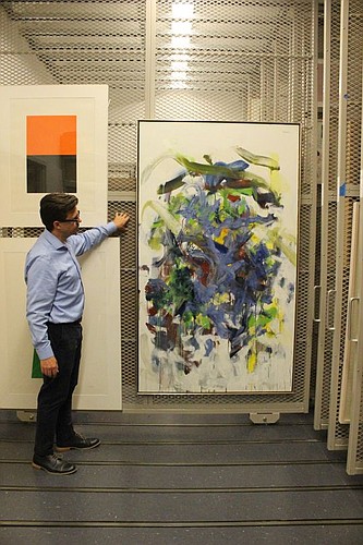 Museum of Contemporary Art Jacksonville Acting Director Ben Thompson with Joan Mitchell's "Chord III," one of the objects in The Donald and Maria Cox Collection. (Photo by Jonathan Duck/Museum of Contemporary Art)