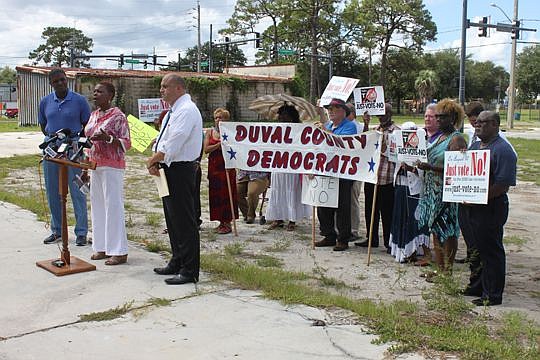 State Sen. Audrey Gibson is flanked by former state Sen. Tony Hill and Duval County Democratic Party Chair Neil Henrichsen while discussing her opposition to the pension referendum. The party held a news conference near the Gateway Mall on Tuesday to ...