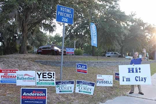 Campaigns signs adorn much of the open space around the outskirts of Resurrection Episcopal Church in East Arlington. Polling Station No. 206 also had a couple of candidates, including Florida House District 12 Republican candidate Clay Yarborough, wa...