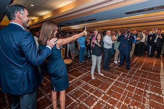 Melissa Nelson gives her supporters a thumbs-up Tuesday evening, shortly after she successfully toppled incumbent Angela Corey in the Republican primary for 4th Judicial Circuit state attorney. Nelson will face write-in candidate Kenny Leigh in November.