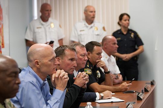 Gov. Rick Scott, Mayor Lenny Curry, City Emergency Preparedness Division Chief Steve Woodard and Sheriff Mike Williams listen to updates from the National Weather Service on Tropical Storm Hermine. Curry later declared a state of emergency starting at...