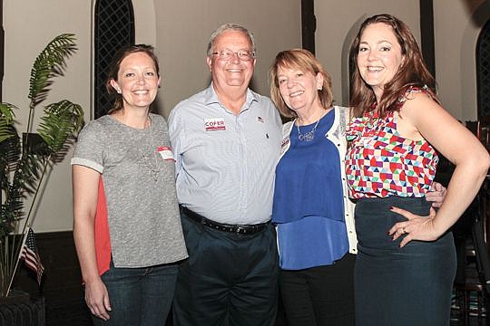 Charlie Cofer with his wife, Emily, and their daughters, Anne Boccuzzi, left, and Laura Cofer-Taylor on Tuesday after Cofer defeated Public Defender Matt Shirk in the Republican primary. Cofer faces a write-in candidate in November.