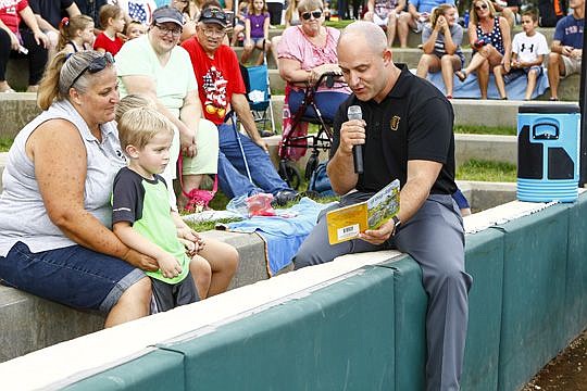 Jacksonville Suns owner Ken Babby reads "A Day on Safari" to the fans during the July 3 home game. It was an unexpected moment for the first-year owner, but one of his better memories.