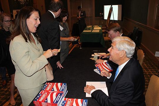 Circuit Judge Tatiana Salvador chats with Bob Graham, a former Florida governor and U.S. senator, after Friday's Jacksonville Bar Association luncheon. Graham was the keynote speaker, talking civics, politics and his history to a crowd of more than 20...