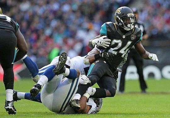 Running baak T.J. Yeldon tries to escape a tackle during Sunday's game against Indianapolis.