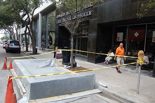 The concrete foundation was poured Tuesday for the pilot program parklet along West Adams Street Downtown in front of the Ed Ball Building. Construction of the miniature public park that is replacing a single-metered parking place is expected to be co...