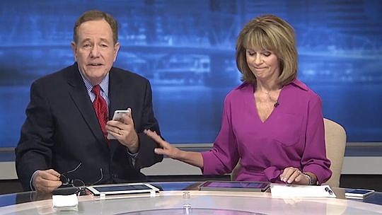 WJXT TV-4 news anchor Mary Baer pats colleague Tom Wills on the arm as he begins his emotional plea for viewers to take the warnings of Hurricane Matthew seriously.