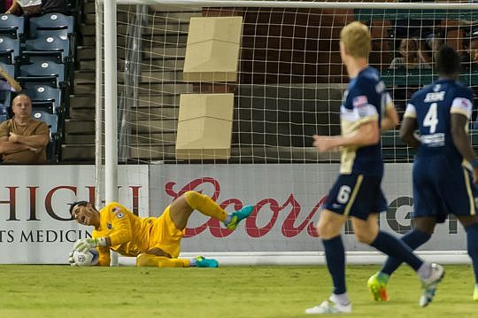 Jacksonville Armada FC goalkeeper Miguel Gallardo makes a save in the first half of the team's Saturday night 4-2 loss to the New York Cosmos at Community First Park. Attendance for the home match was 3,044.
