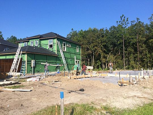 A crew works on a Dream Finders Homes site in Durbin Crossing in Northwest St. Johns County. Builders are struggling to keep pace with the need for new homes due to a manpower shortage.