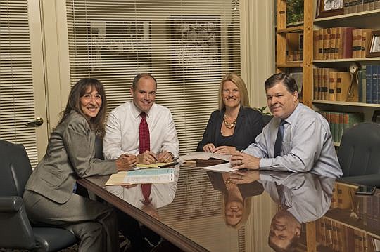 The Bedell Firm family law team of paralegal Patricia Abraham and attorneys Michael Lockamy, Ashley Greene and Al Brooke. Greene is heading up the team.