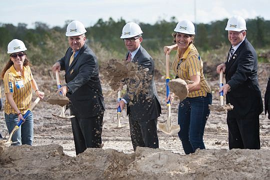 City Council member Danny Becton, Mayor Lenny Curry and council member Aaron Bowman help shovel a little dirt Thursday on the future site of Jacksonville's first Ikea. The elected officials were joined by representatives of the Swedish retailer known ...