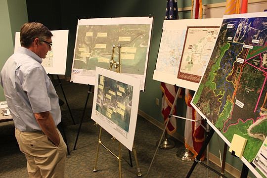 Architect Richard Skinner looks at a series of past maps and studies of the St. Johns River. He's taken part in some of those past studies, but is optimistic the one initiated by City Council President Lori Boyer will end up with some results.