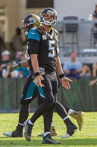 Bad bounce: Jacksonville Jaguars quarterback Blake Bortles walks off the field while looking up to watch the replay of his second interception of the day. The fluke play should have been an incompletion at the feet of running back T.J. Yeldon, but it ...